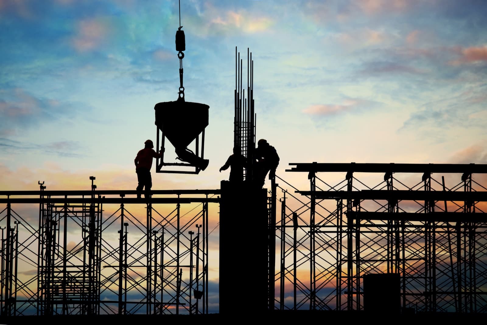 Concrete pour in progress on a Florida job site at dusk